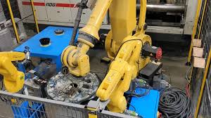 Plastic industry automation solutions including robotic molding and assembly